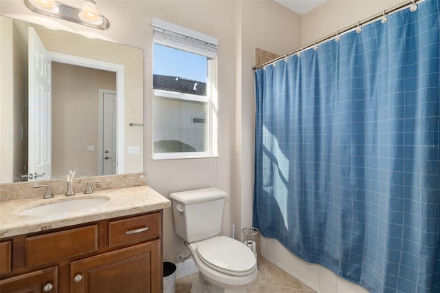 full bathroom featuring shower / bath combo with shower curtain, tile patterned flooring, vanity, and toilet