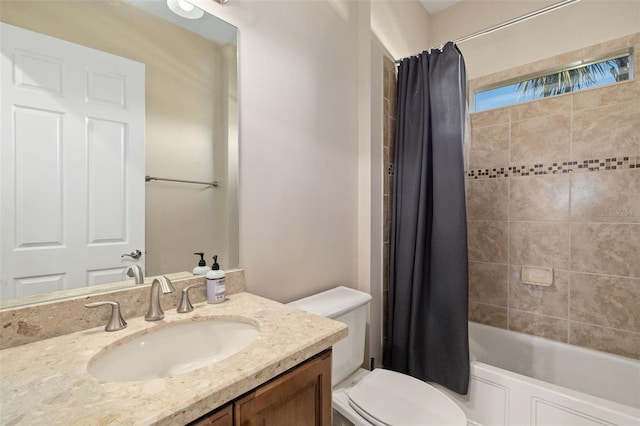 full bathroom featuring shower / tub combo, vanity, and toilet