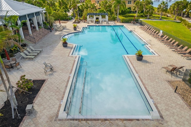 view of swimming pool with a pergola and a patio