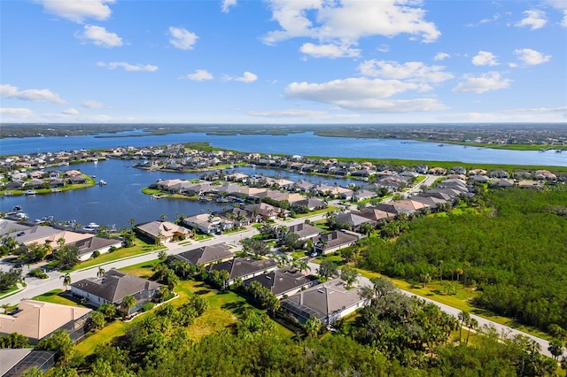 birds eye view of property featuring a water view