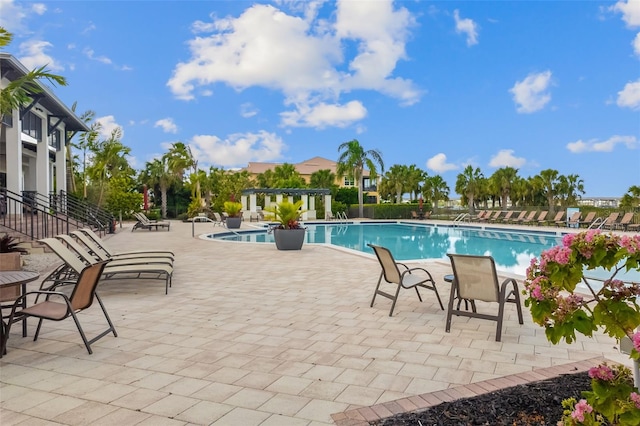 view of pool featuring a patio area and a pergola