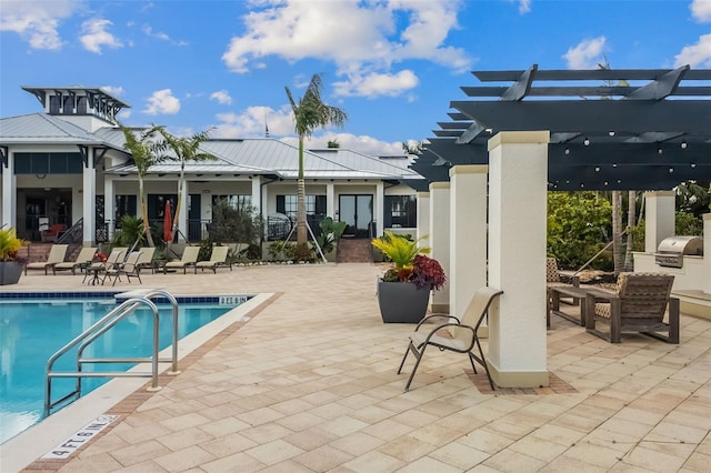 view of pool with a pergola, area for grilling, and a patio area