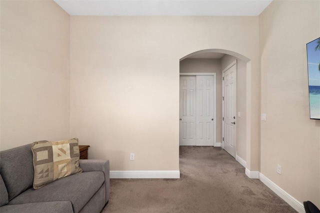 942 Preservation St, Bradenton, FL 34208 - living area with arched walkways, carpet, and baseboards