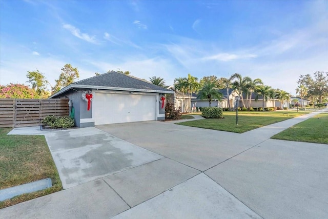 ranch-style home with a garage and a front yard