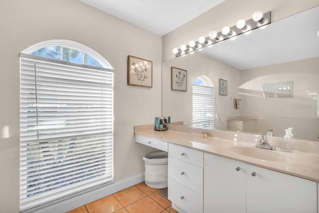 bathroom with tile patterned floors and vanity