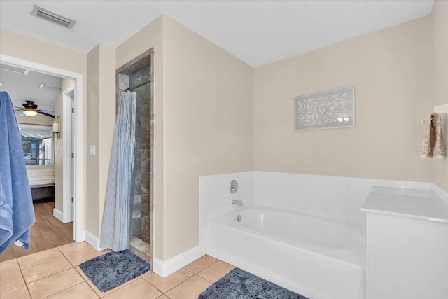 bathroom featuring tile patterned flooring, ceiling fan, and shower with separate bathtub