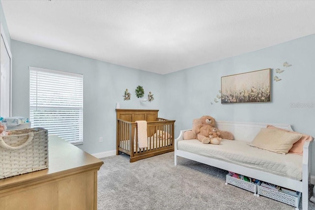 bedroom featuring light carpet