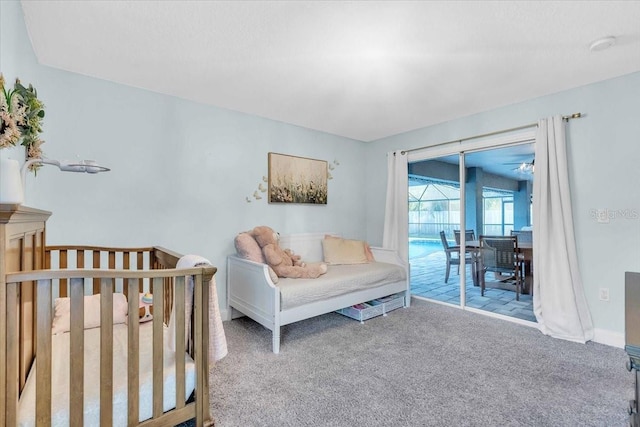 bedroom with access to outside and light colored carpet