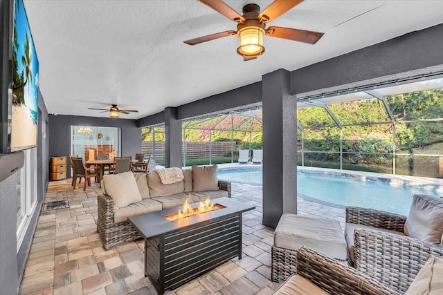 interior space with glass enclosure and a fire pit