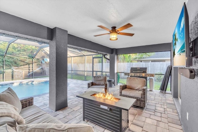 sunroom / solarium with ceiling fan