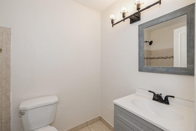 bathroom featuring walk in shower, tile patterned flooring, vanity, and toilet