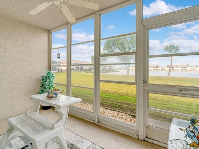 sunroom / solarium with ceiling fan