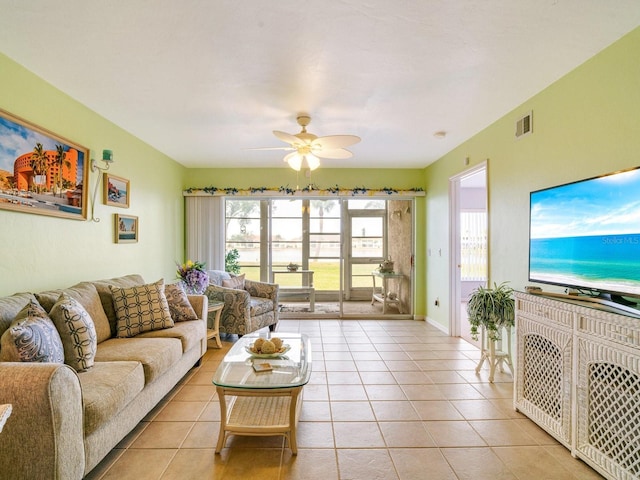 tiled living room featuring ceiling fan