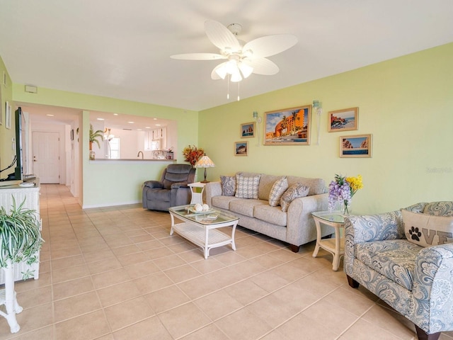 tiled living room featuring ceiling fan