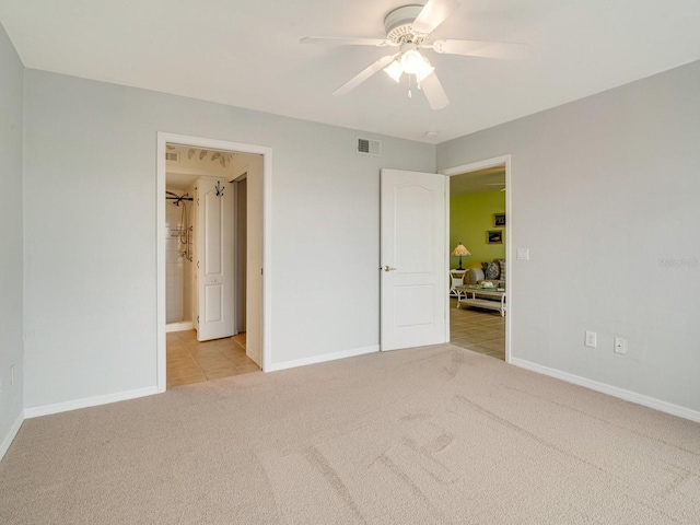 unfurnished bedroom with ceiling fan and light colored carpet