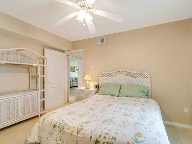 carpeted bedroom with ceiling fan