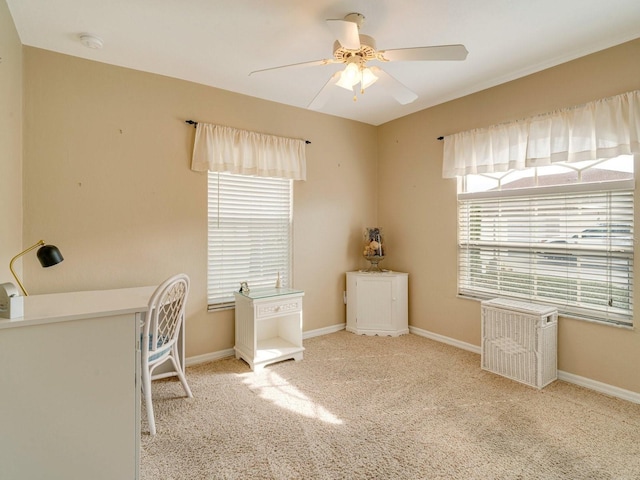 carpeted home office with ceiling fan