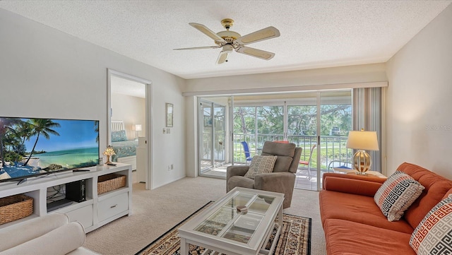 living room with light carpet, a textured ceiling, and ceiling fan