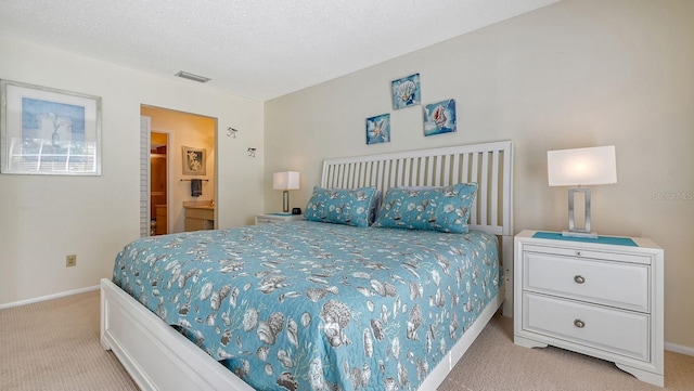 carpeted bedroom with a textured ceiling