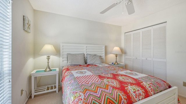 bedroom with carpet flooring, ceiling fan, and a closet