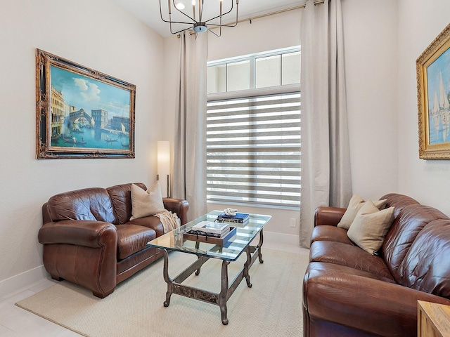 living room with plenty of natural light, light tile patterned floors, and a chandelier