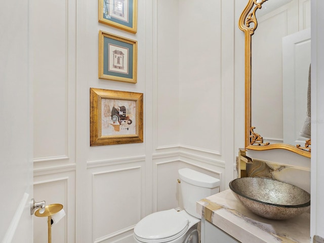 bathroom with vanity and toilet