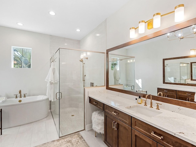 bathroom featuring separate shower and tub, tile patterned floors, and vanity