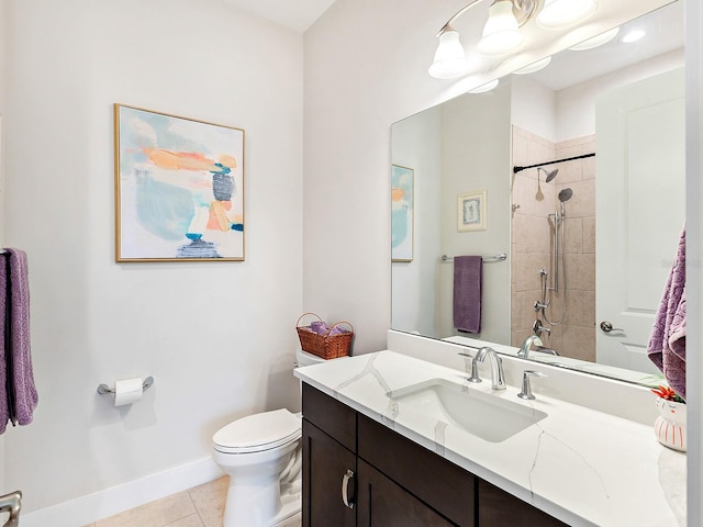 bathroom featuring tiled shower, tile patterned flooring, vanity, and toilet