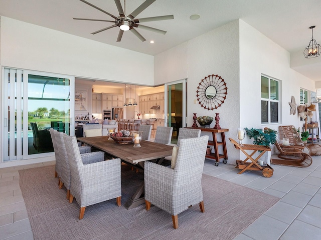 dining room featuring ceiling fan and light tile patterned flooring