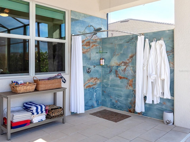 bathroom featuring tile patterned floors and a shower