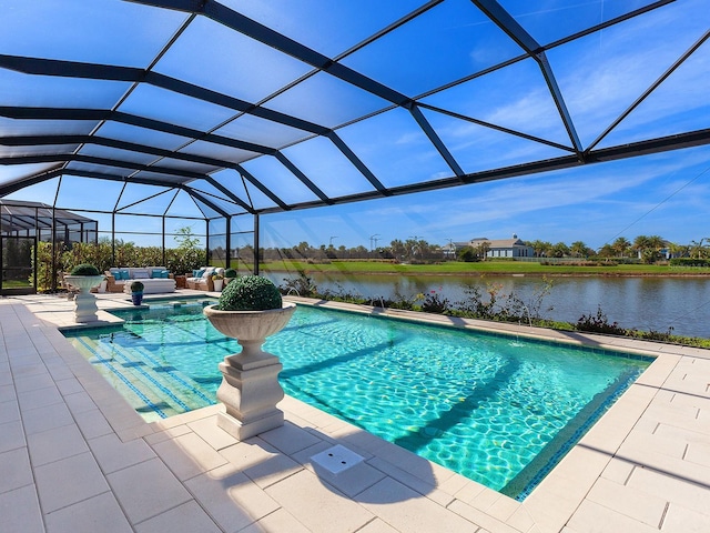 view of swimming pool with a water view, glass enclosure, and a patio area