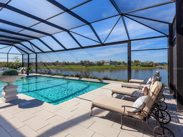 view of swimming pool featuring a lanai, a patio area, and a water view