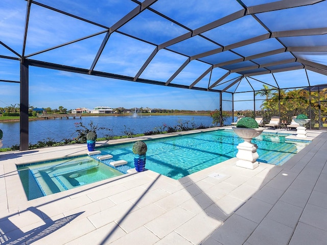 view of pool with glass enclosure, a water view, an in ground hot tub, and a patio