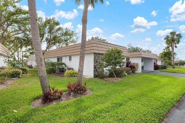 single story home with a garage and a front yard