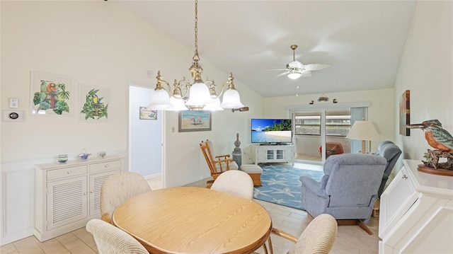 dining room featuring lofted ceiling and ceiling fan with notable chandelier