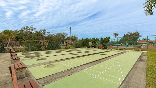 surrounding community with tennis court