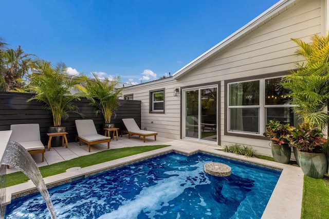 view of swimming pool with a patio area