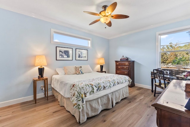 bedroom with light wood-type flooring, ceiling fan, and ornamental molding