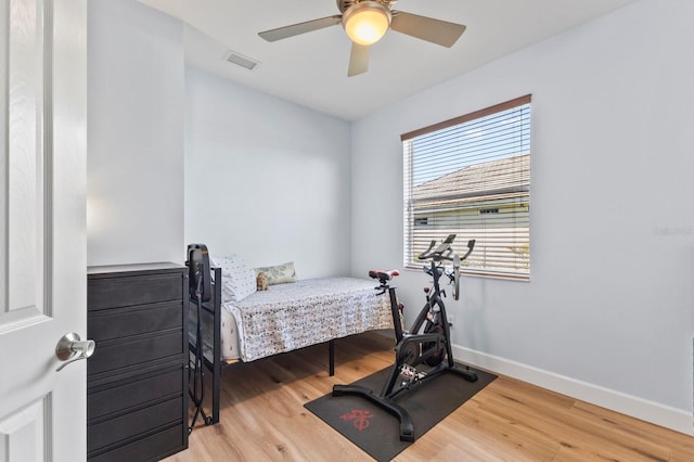 bedroom with hardwood / wood-style flooring and ceiling fan