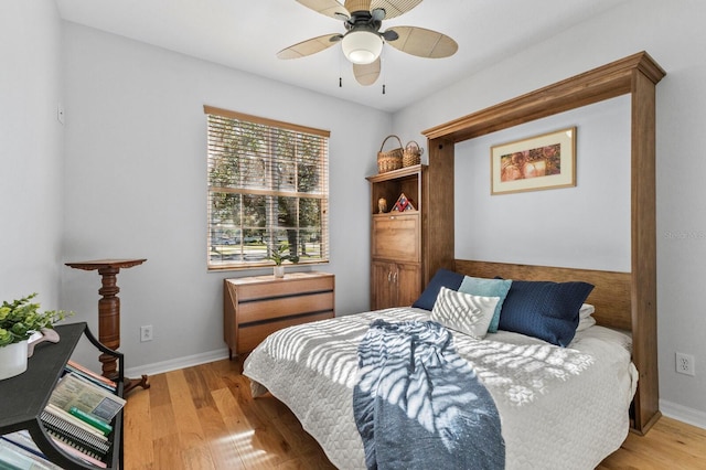 bedroom featuring light hardwood / wood-style flooring and ceiling fan