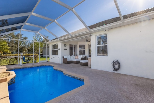 view of swimming pool with a patio area, ceiling fan, glass enclosure, and an outdoor hangout area