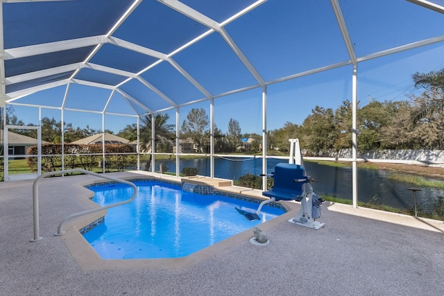 view of swimming pool with pool water feature, a lanai, a patio area, and a water view