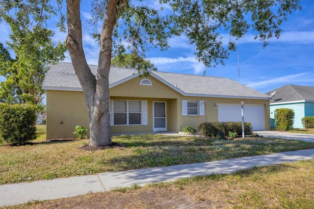 single story home with a front yard and a garage