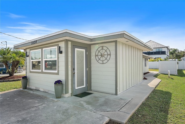 view of outbuilding featuring a yard