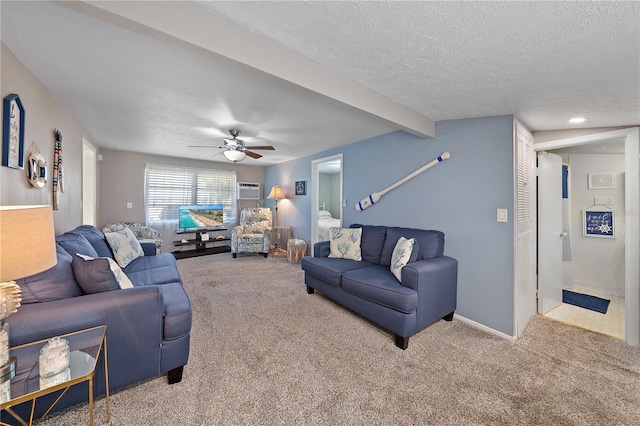 living room featuring carpet flooring, ceiling fan, beamed ceiling, and a textured ceiling