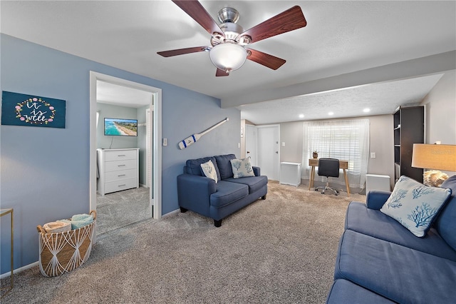 living room with ceiling fan and carpet floors