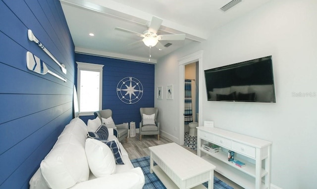 living room featuring ceiling fan and wood-type flooring