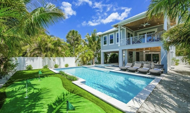 view of swimming pool featuring a jacuzzi, a patio, and ceiling fan