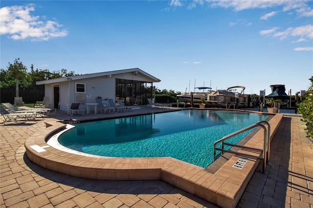 view of pool featuring a patio area