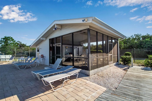 view of patio / terrace with a sunroom